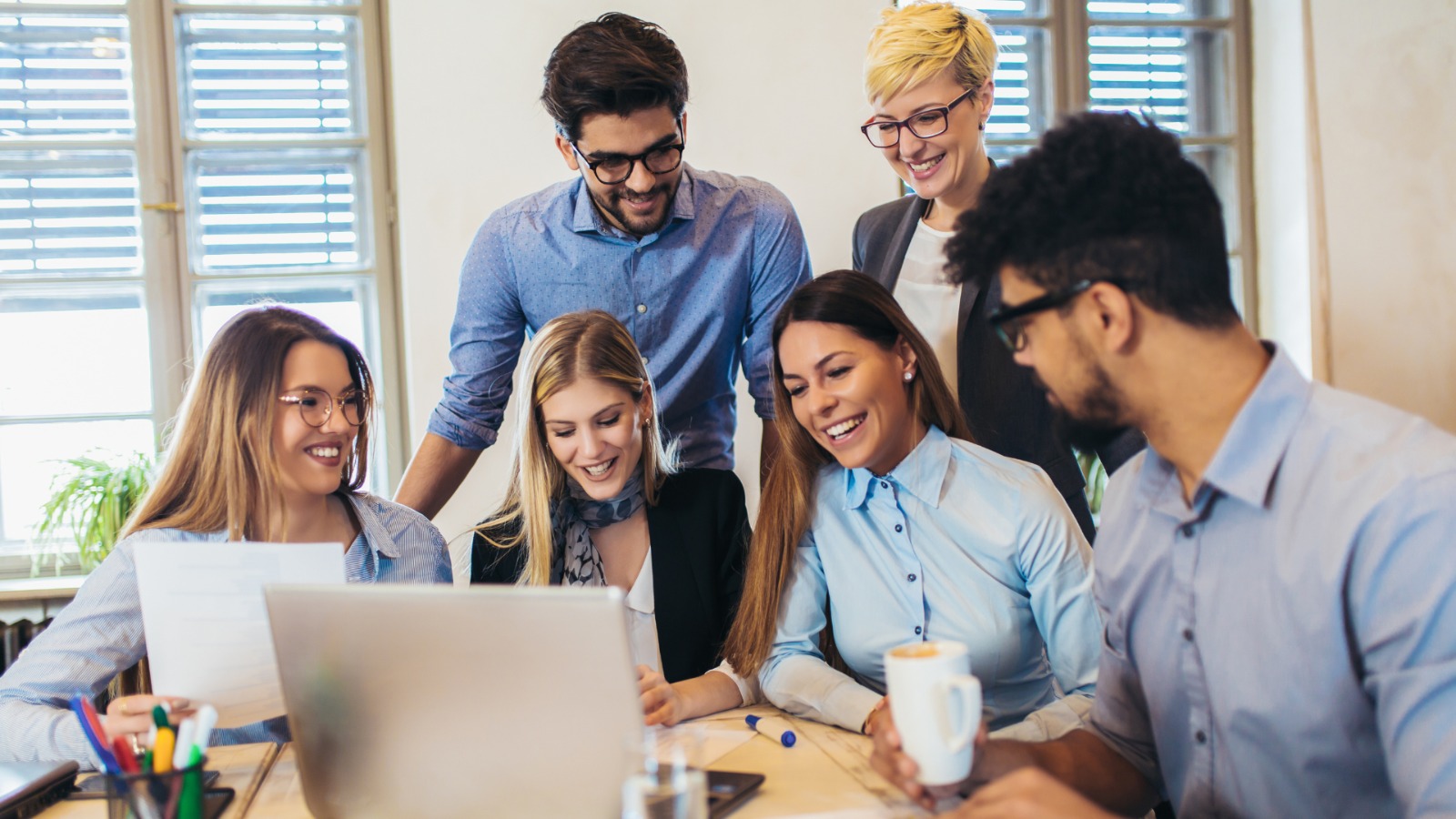 Pro4 team collaborating in a modern office